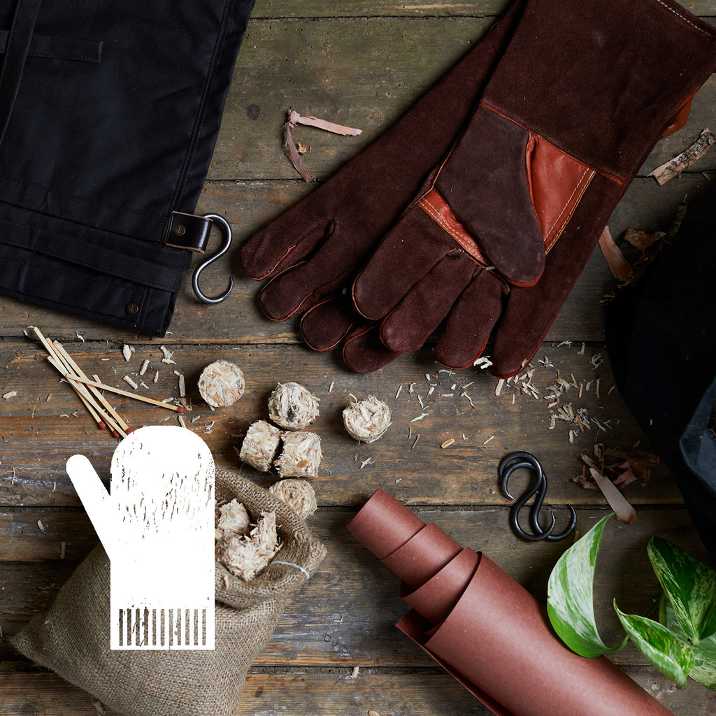BBQ fire globes, barbecue gloves, high quality BBQ gloves, leather barbecue gloves, wax cotton apron UK, outdoor apron, apron for outdoor cooking, high quality barbecue equipment, artisan barbecue gloves, wood BBQ brush UK, wood barbecue brush, log bag 
